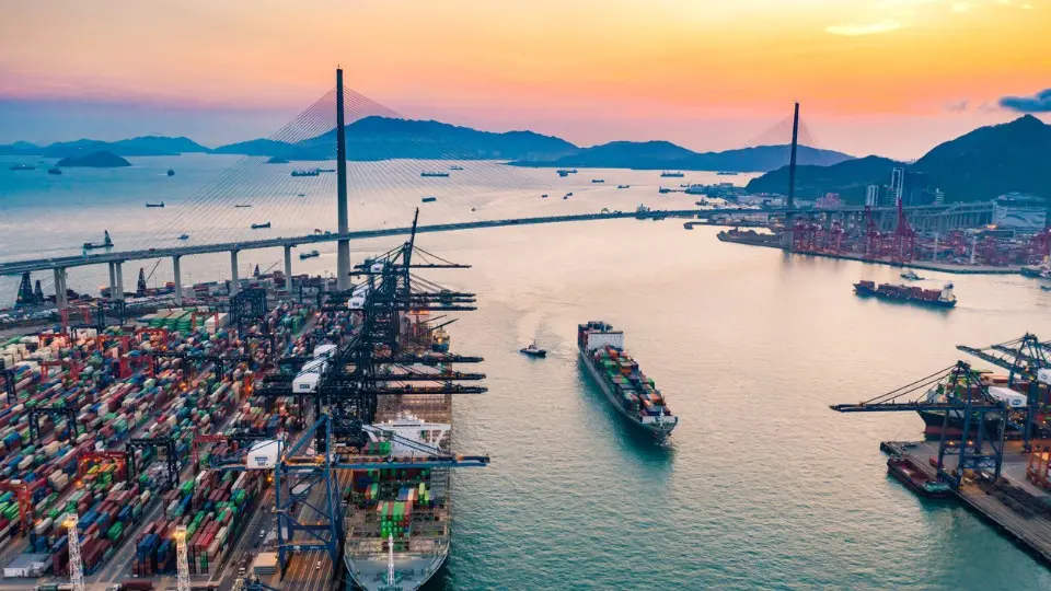 cargo ship at sunset in the Port of Hong Kong