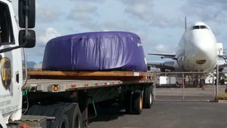 Engine cowling on ground freight tractor trailer