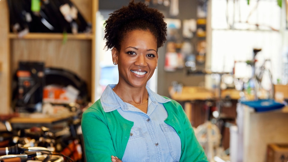 Business owner smiling in her store