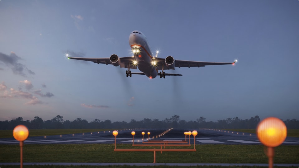 Airplane taking off from the airport runway at night