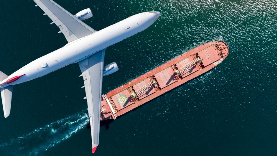 Cargo freight being shipped over the Atlantic by air and ocean