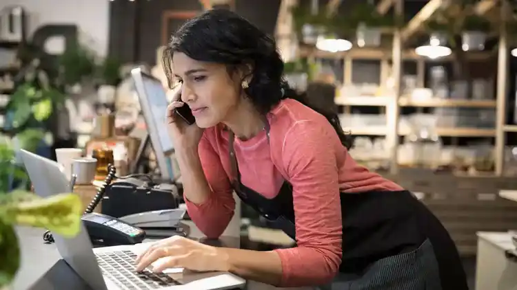 Woman in a shop on the phone