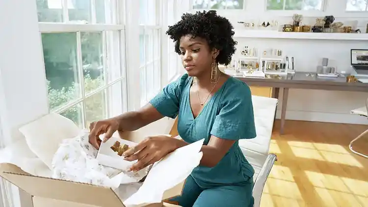 Small businesswoman scheduling a pickup.